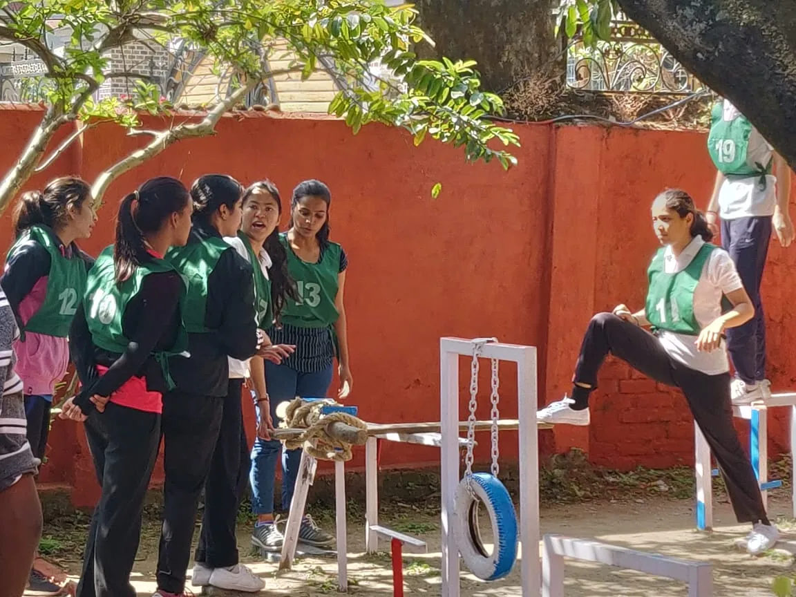 Women participants discussing an outdoor group task